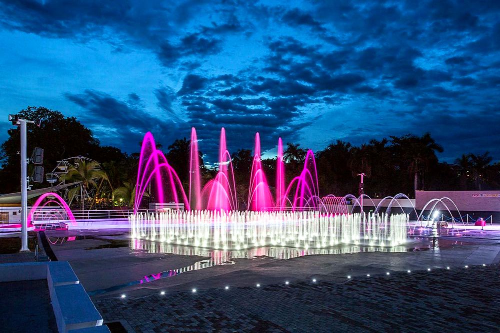 Illuminated dancing fountains at night in the park in Melgar, Tolima